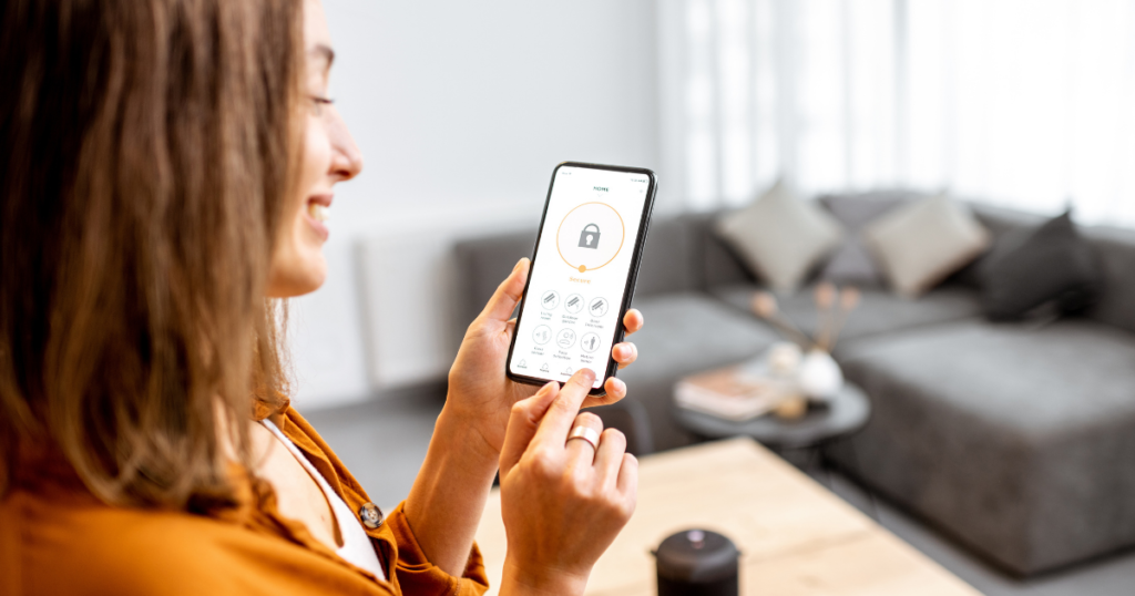 woman using smart phone in home to control the temperature